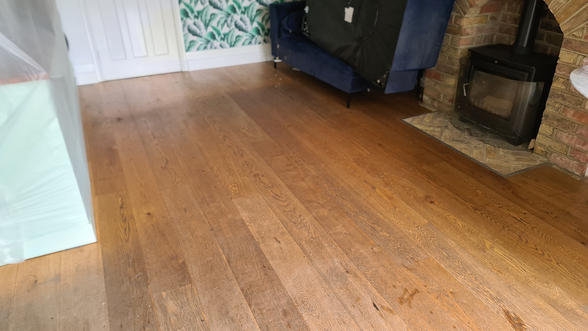 Before the restoration of engineered wood floors - Ealing